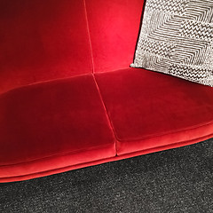 Image showing Red velvet sofa with gray ornamental cushion