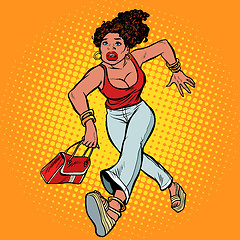 Image showing Beautiful woman with a bag running