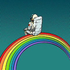 Image showing astronaut sits on a rainbow