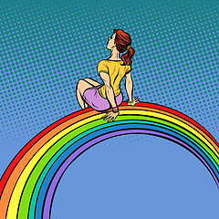 Image showing The girl visionary young woman sitting on a rainbow