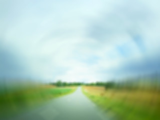 Image showing Defocused image of a country road in field