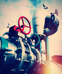 Image showing Industrial zone, Steel pipelines and valves against blue sky