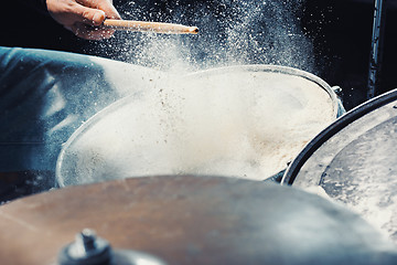 Image showing Drummer rehearsing on drums before rock concert. Man recording music on drum set in studio