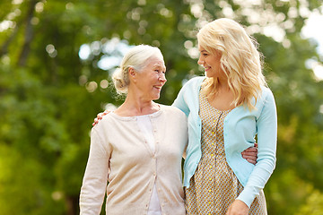 Image showing daughter with senior mother hugging at park