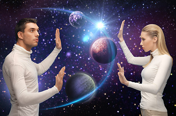 Image showing futuristic couple over planet and stars in space