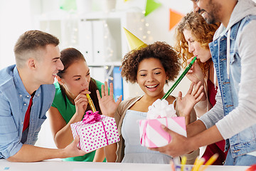 Image showing team greeting colleague at office birthday party