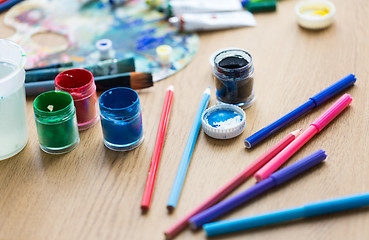 Image showing gouache colors, felt tip pens and pencils on table