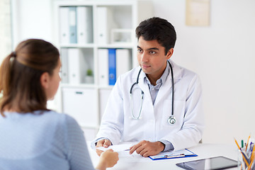 Image showing doctor giving prescription to patient at hospital