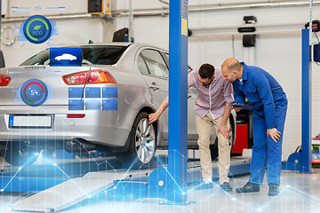 Image showing auto mechanic with clipboard and man at car shop