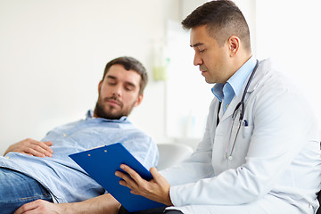 Image showing doctor and man with health problem at hospital