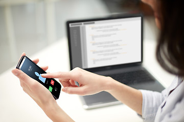 Image showing close up of woman with smartphone at office