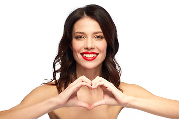 Image showing beautiful woman with red lipstick and hand heart