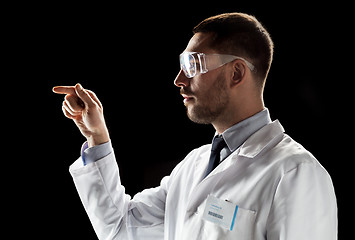 Image showing doctor or scientist in lab coat and safety glasses