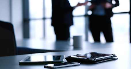 Image showing tablet, mobile cell phone and cup of coffee  in office with busi