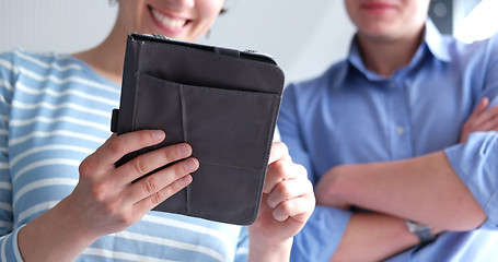 Image showing low angle shot of business people using technology