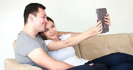 Image showing Young Couple using digital tablet at home