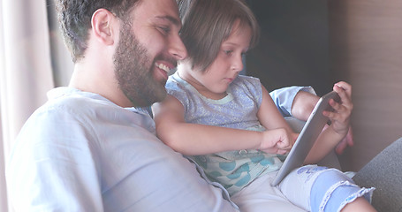 Image showing Father Daughter using Tablet in modern apartment