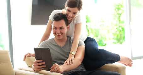 Image showing Young Couple using digital tablet at home