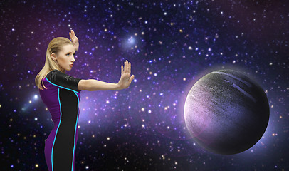 Image showing futuristic woman over planet and stars in space