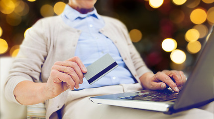 Image showing senior woman with laptop and credit card