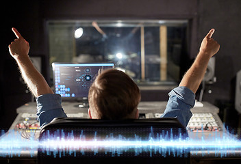 Image showing man at mixing console in music recording studio