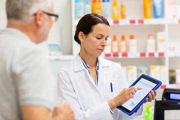 Image showing apothecary and customer with tablet pc at pharmacy