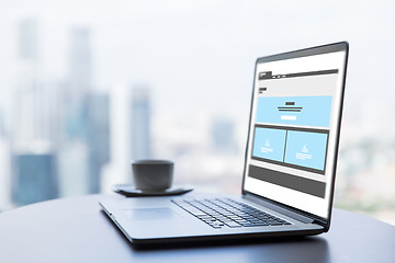 Image showing laptop with web page interface design on screen