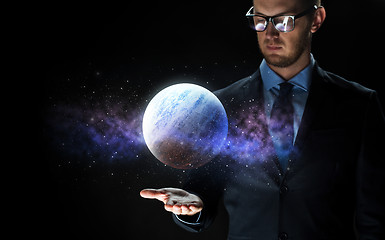 Image showing close up of businessman with planet hologram