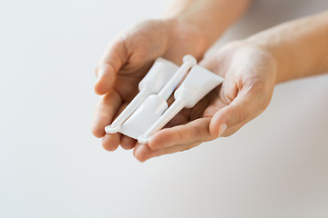 Image showing hand holding tubes of micro enema