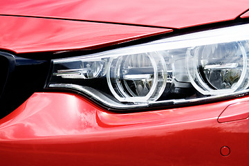 Image showing Red sports car headlight