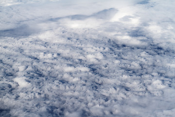 Image showing Sunrise above clouds from airplane window