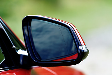 Image showing Red sports car rearview mirror