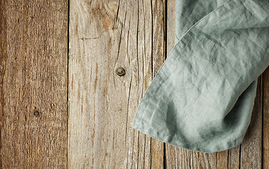 Image showing linen napkin on wooden background