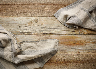 Image showing linen napkin on wooden background