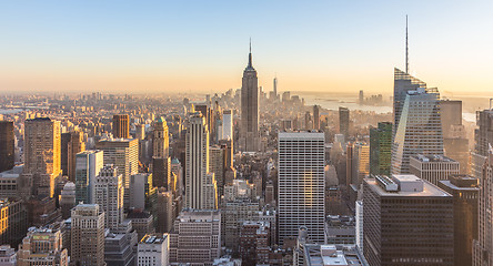 Image showing New York City skyline with urban skyscrapers at sunset, USA.