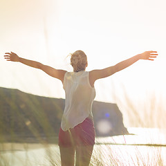 Image showing Free Happy Woman Enjoying Sun on Vacations.