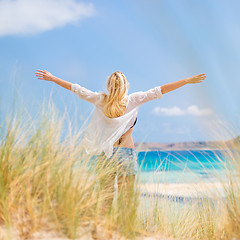 Image showing Free Happy Woman Enjoying Sun on Vacations.