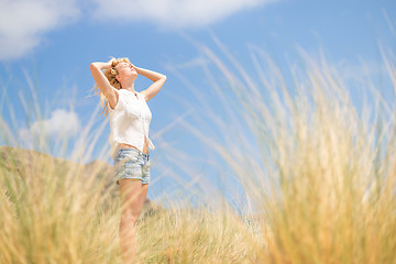 Image showing Free Happy Woman Enjoying Sun on Vacations.