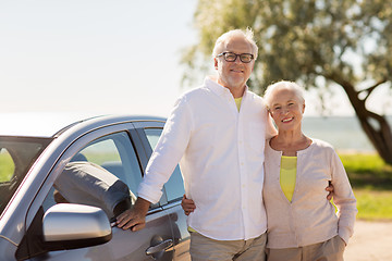 Image showing happy senior couple with car in summer