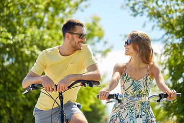 Image showing happy couple with bicycles at country