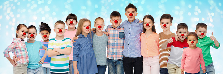 Image showing happy children hugging at red nose day