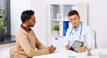 Image showing doctor with tablet pc and male patient at hospital