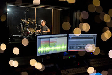 Image showing man playing drum kit at sound recording studio