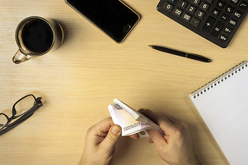 Image showing Hands counting profit money in business space