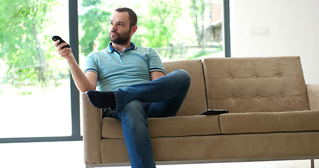 Image showing Happy Man Watching Television