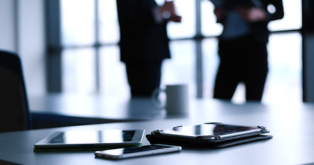 Image showing tablet, mobile cell phone and cup of coffee  in office with busi