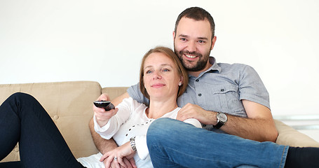 Image showing senoior couple watching tv in modern villa