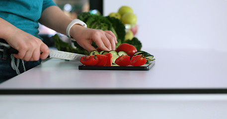 Image showing Young Couple In Modern Kitchen  Preparing Food