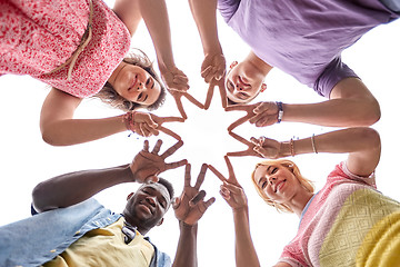 Image showing group of happy friends showing peace hand sign 