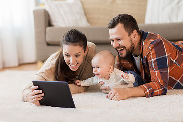 Image showing mother, father and baby with tablet pc at home